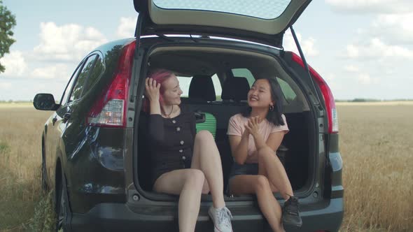 Diverse Females Enjoying Leisure During Road Trip