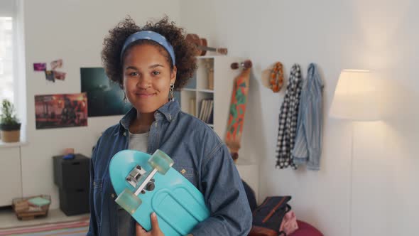 Skater Girl Posing in Bedroom