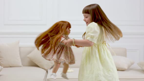 Girl Dancing with Her Doll