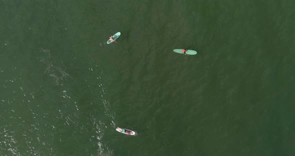 Birds eye view of surfer in the Gulf of Mexico off the coast of Lake Jackson in Texas