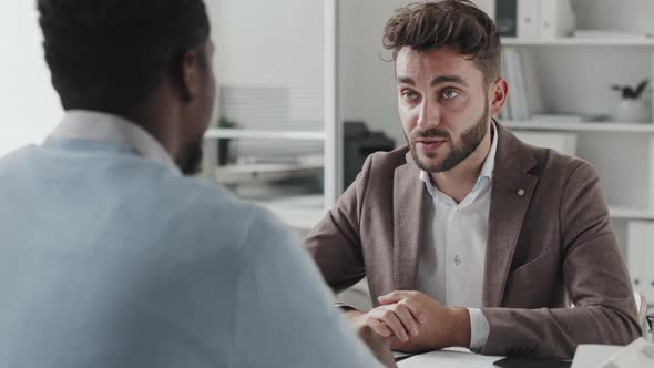 Accountant Consulting Client in Office