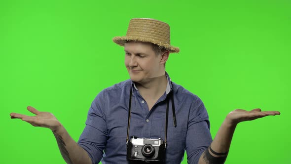 Portrait of Young Man Tourist Photographer Pointing at Something. Chroma Key