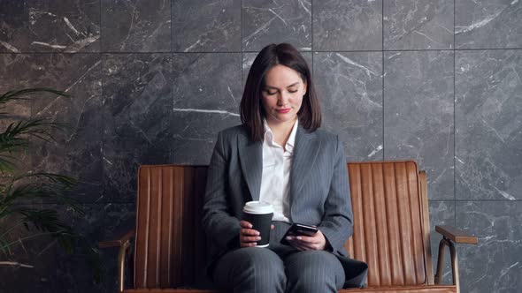 Successful Businesswoman in Costume Types on Smartphone