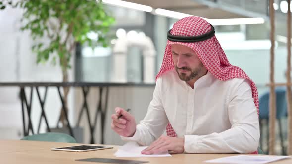 Arab Businessman Having Failure Writing on Paper