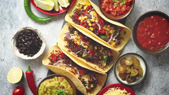 Tasty Mexican Meat Tacos Served with Various Vegetables and Salsa