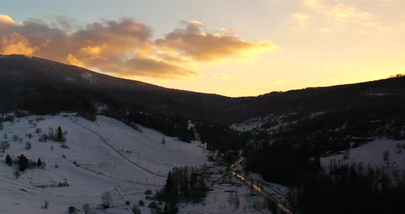 Sunset at Mountains in Winter Aerial View