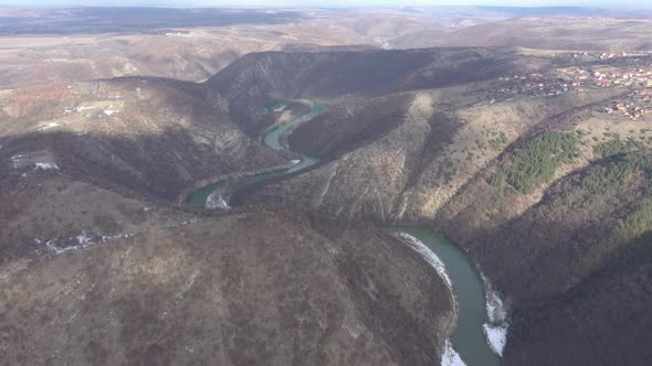 Curvy flow between hills of Timok river 4K drone video