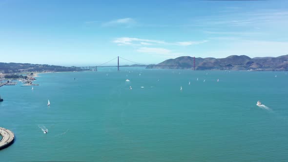 Fast Sailing Boats in the Green Waters of Pacific Ocean at Golden Gate Bridge