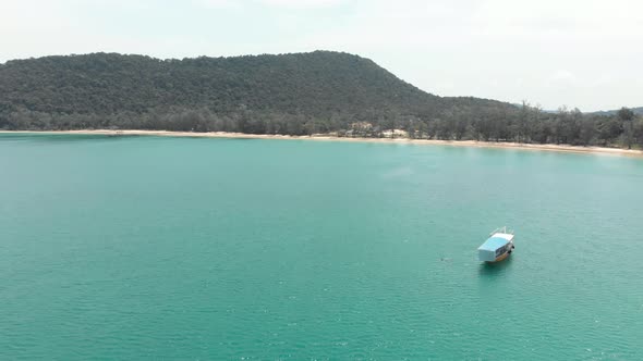 Large Cambodian Boat moored in M'pai Bay near the exotic coast - Aerial Panoramic view