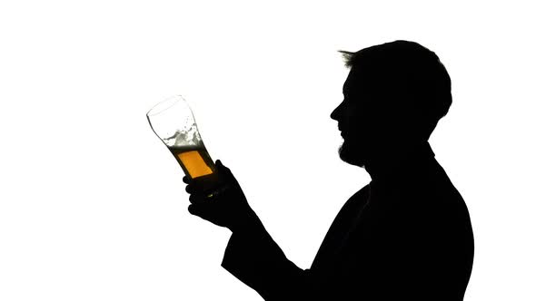 Guy Drinking Beer From a Glass