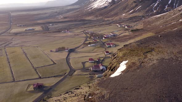 Small Icelandic Village Next to A Mountain