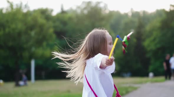 Girl dancing in park. Happy active girl having fun in the park