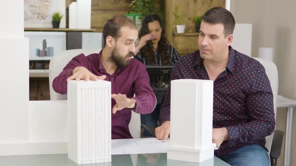 Young Architect Talking with His Construction Engineer