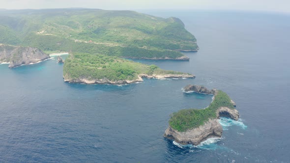 Aerial View of Tropical Island Washed By Ocean Atuh Beach
