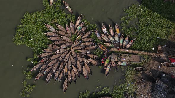 Bangladesh: Small wooden boats are arranged in rows for passenger river crossing on the Buriganga at