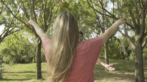 Young couple hugging in park