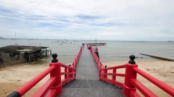 Long Red Japanese Styled Sea Bridge Lays into the Sea