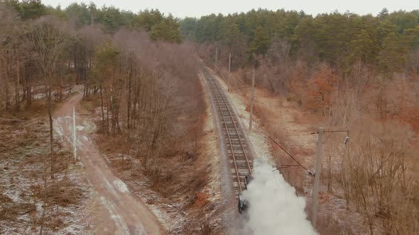 Aerial View of Vintage Steam Engine Train Puffing Smoke
