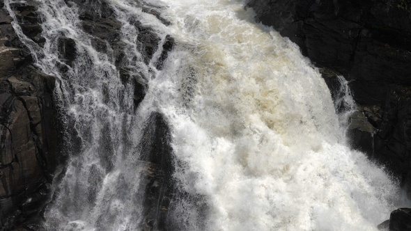 Cascading water falling over the rocks.