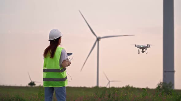 Woman Holding Joystick Controlling Flying Drone Check Correct Operation Windmill