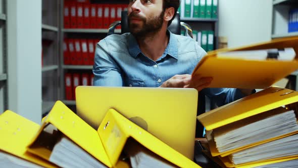 Frustrated executive working at desk