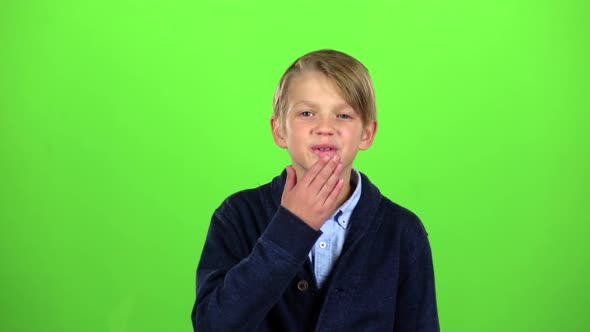 Child Sends an Air Kiss. Green Screen. Slow Motion