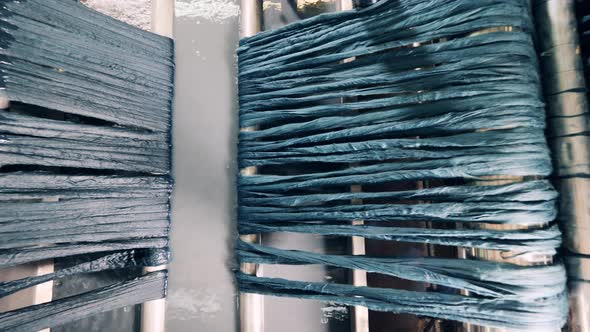 Clothing Pieces are Being Soaked By an Industrial Machine