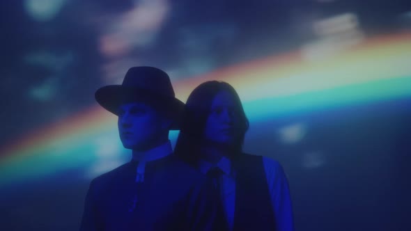 Couple Dressed Like Priest and Schoolgirl In Neon Light