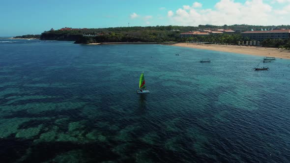 Yach in the Ocean Over Coral Reef