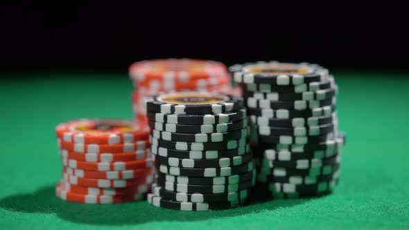 Red and Black Chip Stacks on Green Gaming Table