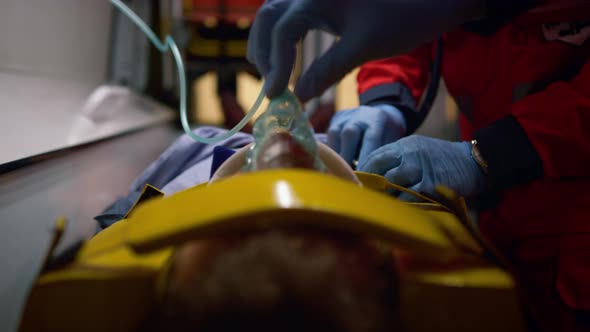 Paramedics Rescuing Victim in Emergency Car