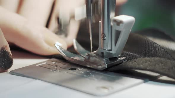 Close Up Shot of Female Hands Working on Sewing Machine