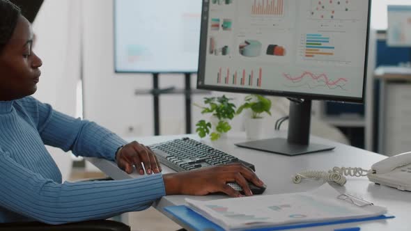 Close Up of Black Paralyzed Disabled Woman Entrepreneur Typing on Computer