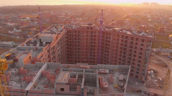 Construction Site in the Middle of the City and Private Houses at Sunset in .