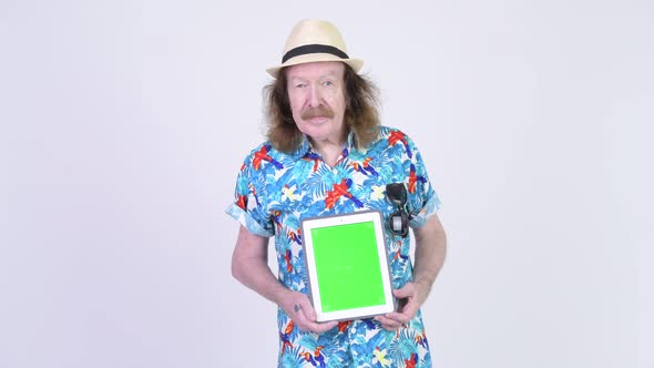 Happy Senior Tourist Man with Mustache Showing Digital Tablet