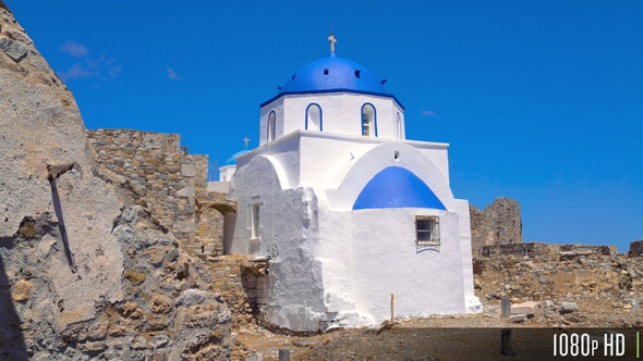 Tracking an Old Greek Church Surrounded by Ruins on Greek Island