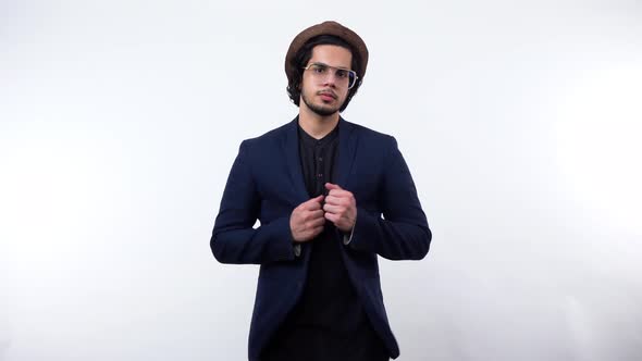 Indian young handsome man wearing cap flaunting with attitude