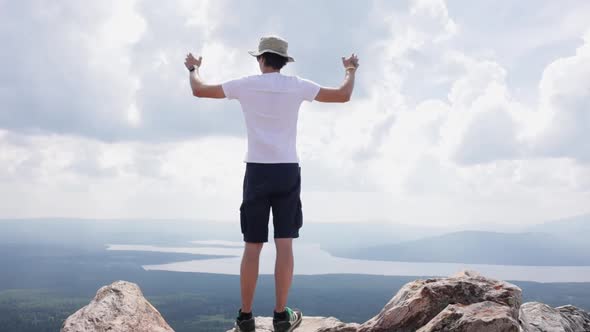 A Man on Top of a Mountain