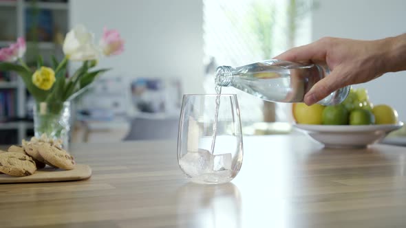 Mineral Water Pouring From Bottle