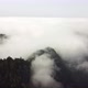 Aerial drone view flying over a forest with clouds - VideoHive Item for Sale