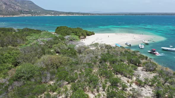 Drone flying over Isla Cabra, Montecristi in Dominican Republic. Aerial backward ascending