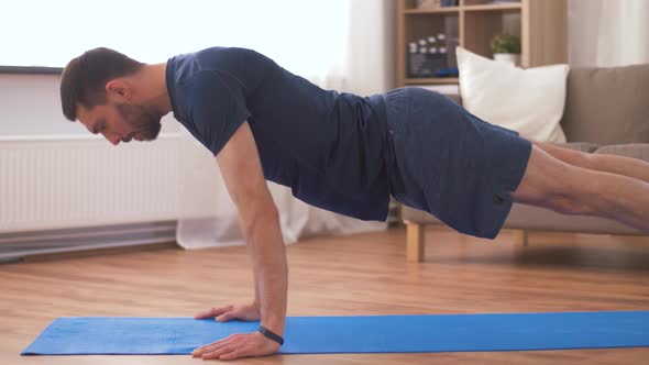 Man Doing Push Ups at Home 7