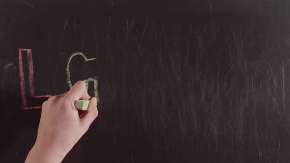 Abbreviation Lgbtq Plus is Drawn with Colored Crayons on a Chalkboard By Hand Timelapse