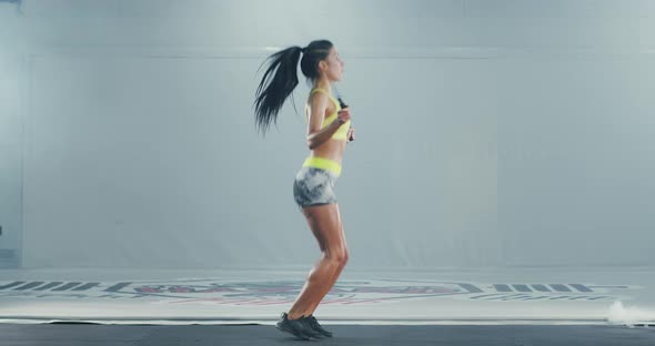 Athletic Woman Using Skipping Rope