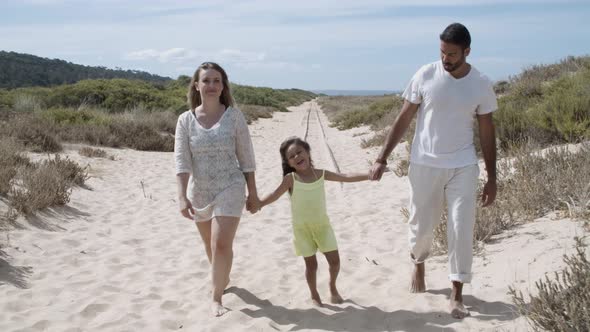 Parents and Little Girl Wearing Summer Clothes