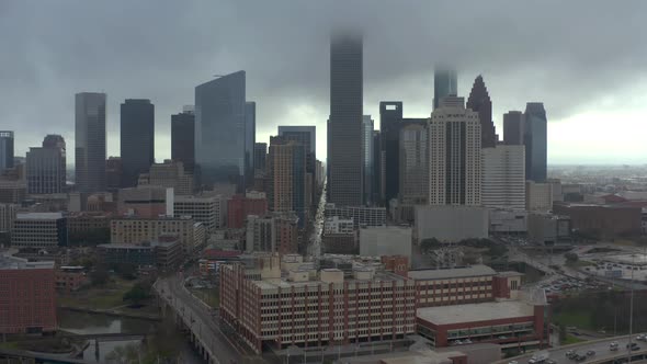 Aerial view of downtown Houston on a rainy and gloomy day. This video was filmed in 4k for best imag