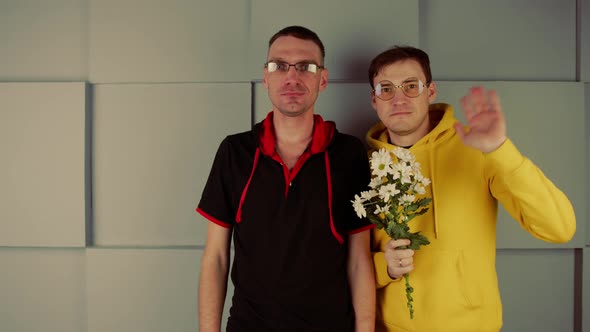 Complexed Men in Glasses Standing Near Wall