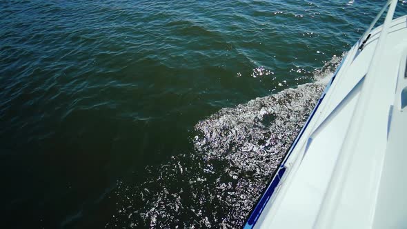 Boat Sailing in the Wind Through the Waves