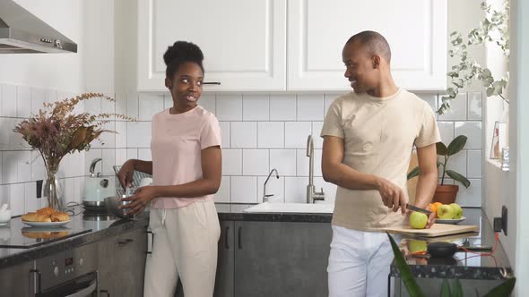 Handsome Guy Helps Her Wife To Prepare Breakfast.