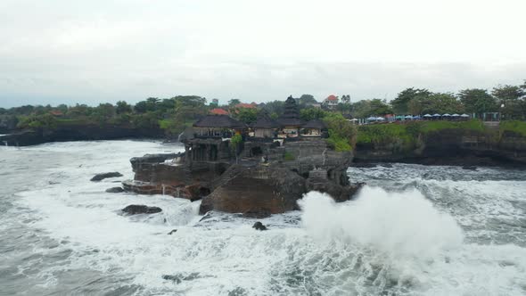 Aerial Rotating Shot of Empty Tanah Lot Temple During the Storm in Bali Indonesia